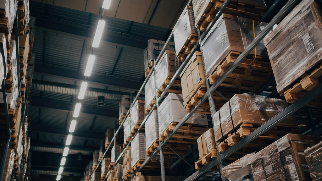 Upward angled view of containers stacked on racks