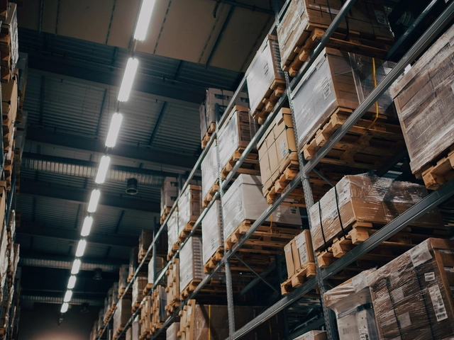 Upward angled view of containers stacked on racks