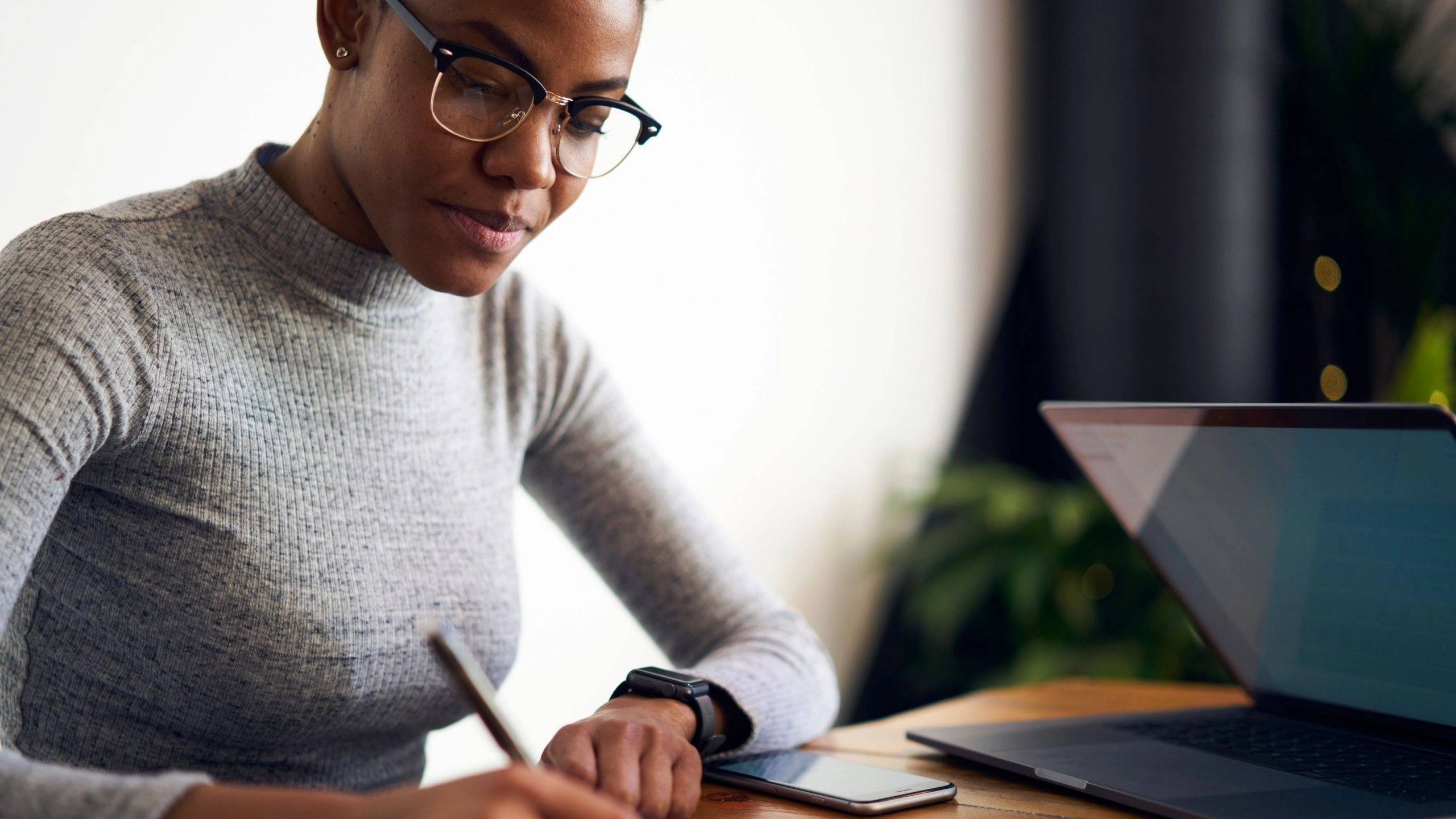 Business owner researches the best global payroll services.