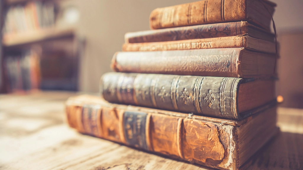 Stack of older books on a wooden table