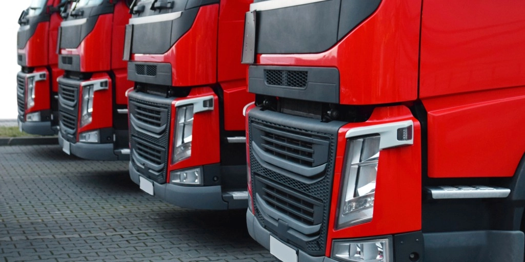 four red semi-trucks