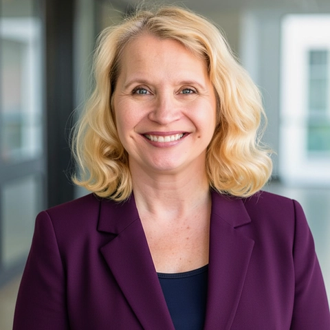 headshot of a woman in a professional blazer