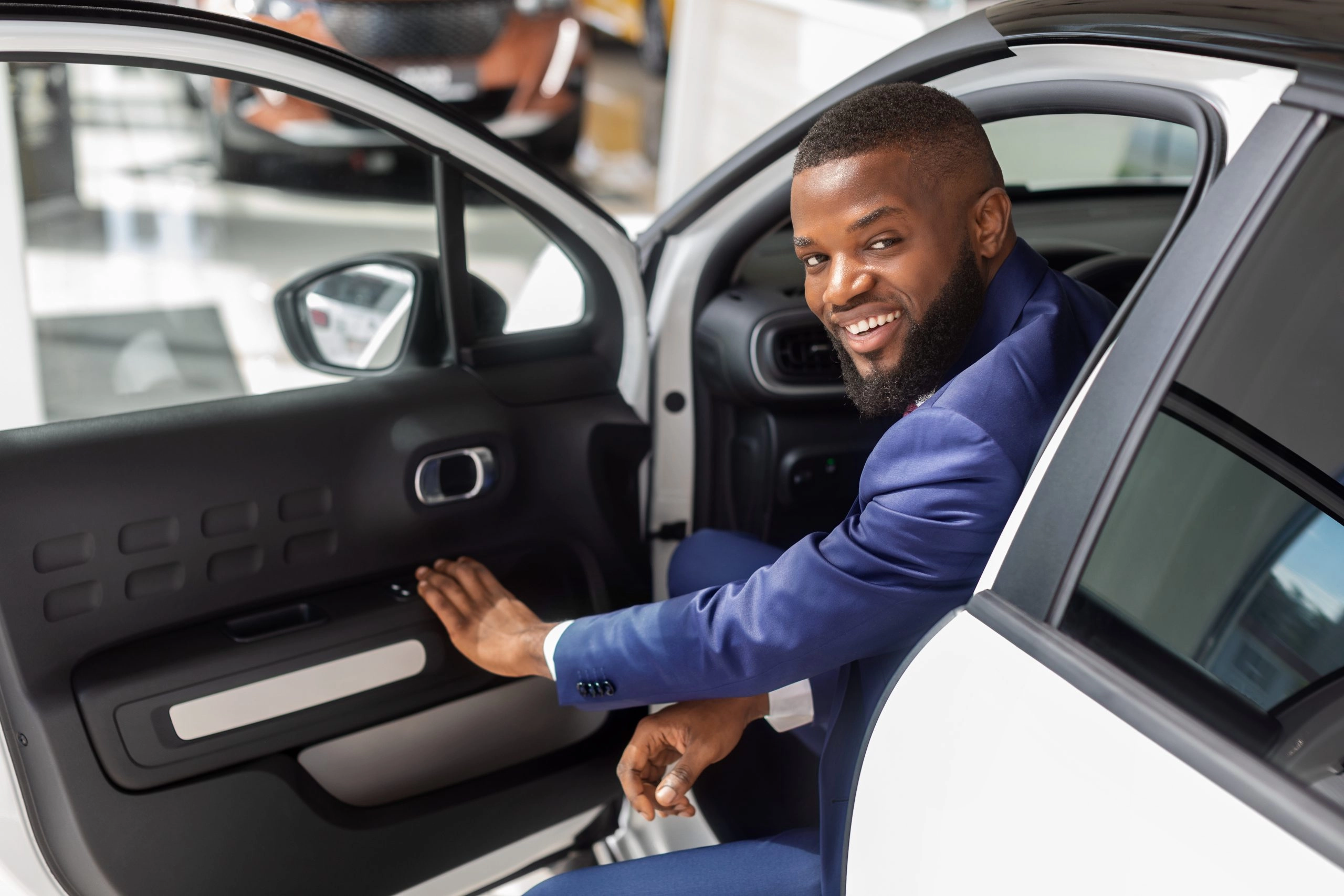 business owner in car with GM credit card reward