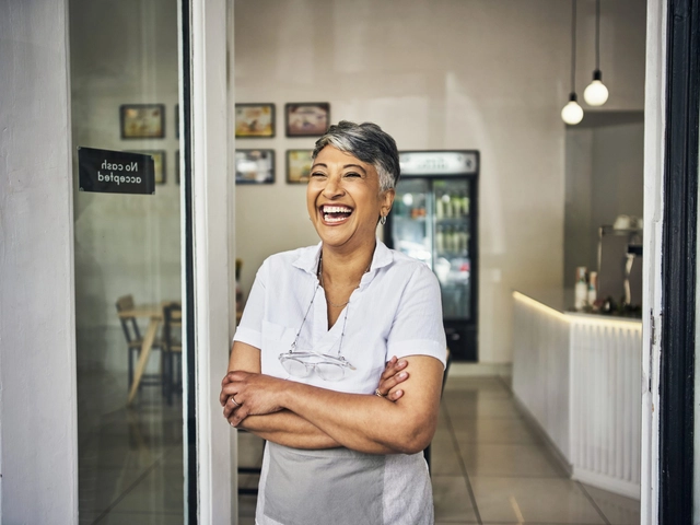 Female business owner smiling after getting tradelines fast