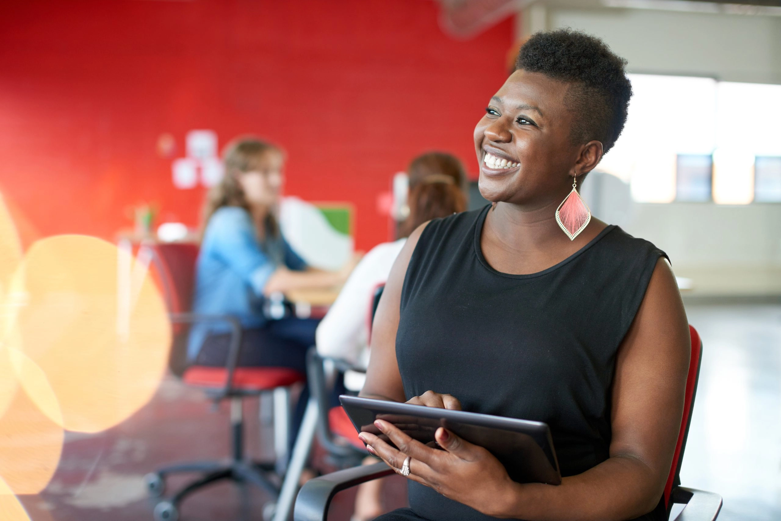 business owner smiling protecting her business from liability