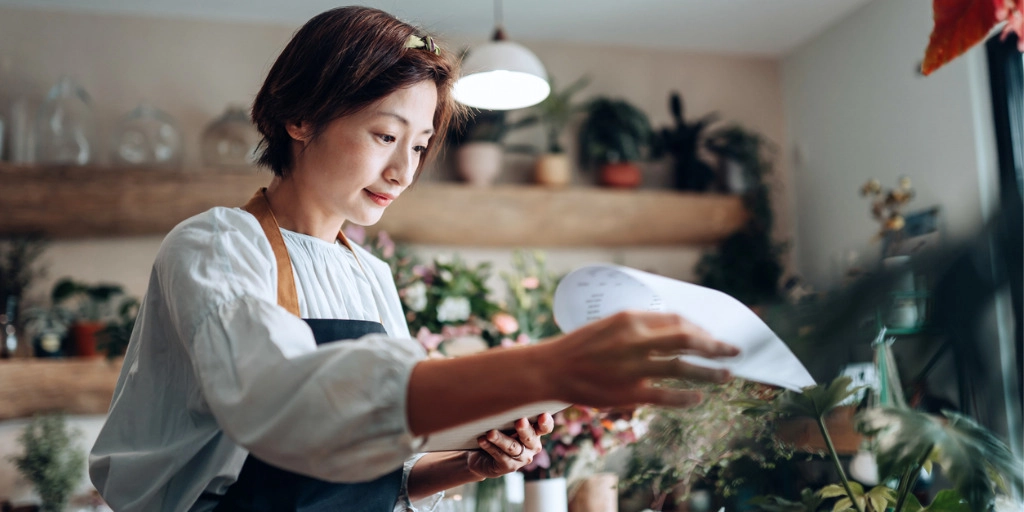 Small business owner learns how to lend money to own business.