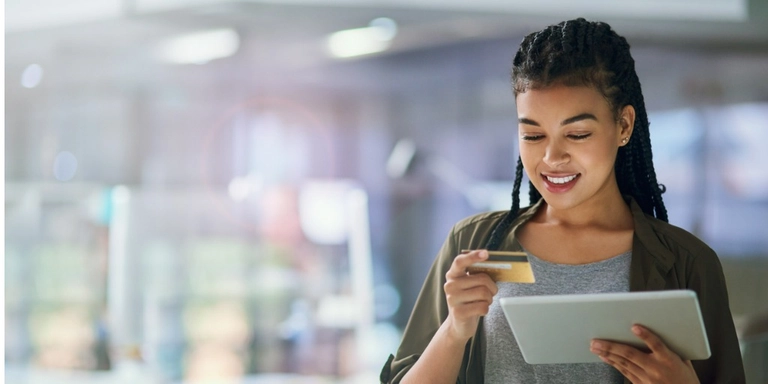An employee using a credit card for expense management