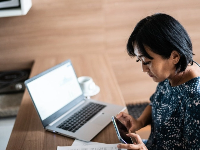 Woman paying bill with online business checking account