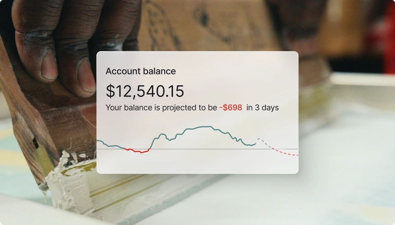 Account balance of $12,540.15 projected to be -$698 in 3 days, with a close-up of a hand using a screenprinting tool.