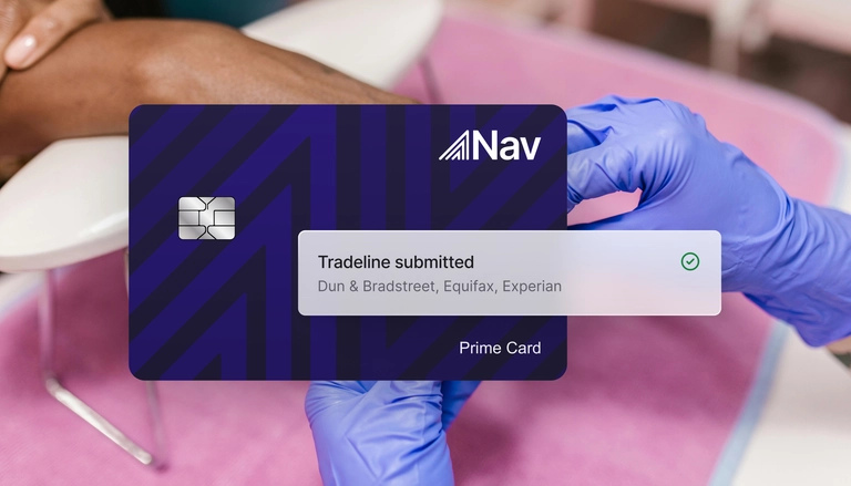 Nav Prime Card with a notification reading 'Tradeline submitted to Dun & Bradstreet, Equifax, Experian' shown over a background of a person receiving a manicure