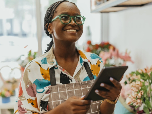 Small business owner uses a new business credit card for growth.