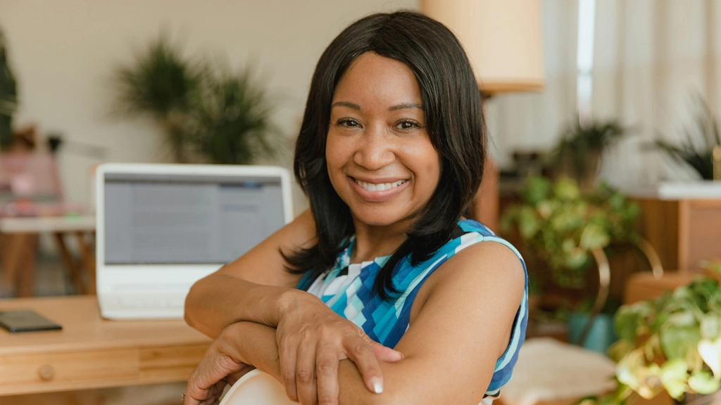 female small business owner smiles at the camera