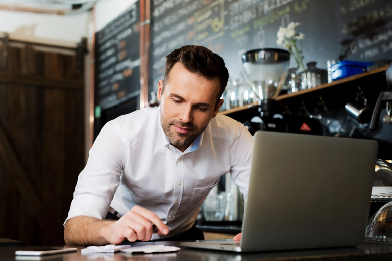 Small business owner examines their business's financial health.