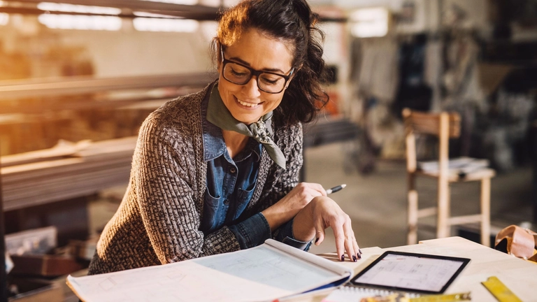 Small business owner uses small business insurance to protect their company.