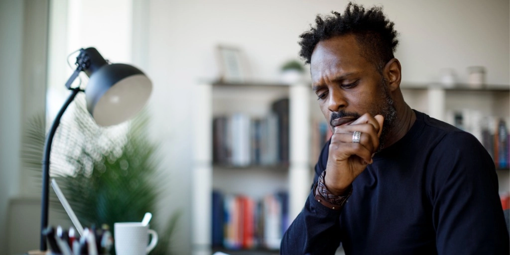 A small business owner looking through his payroll documents